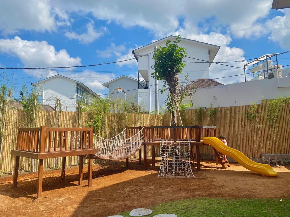 A treehouse with play equipment